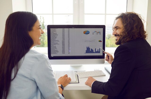 small business owners looking at financial kpis