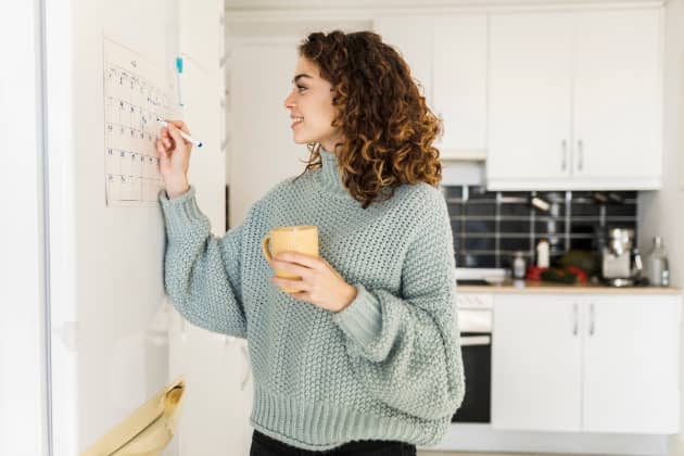 woman checking calendar billing cycle