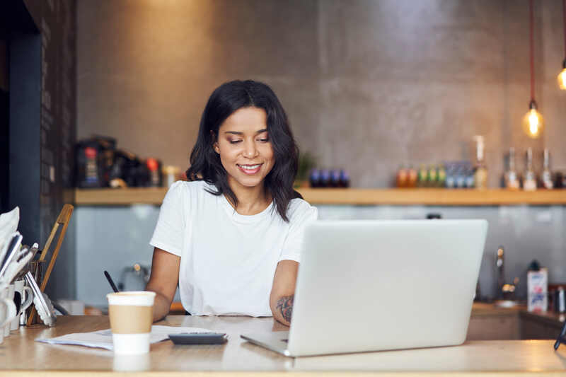 Small business owner calculating business finances