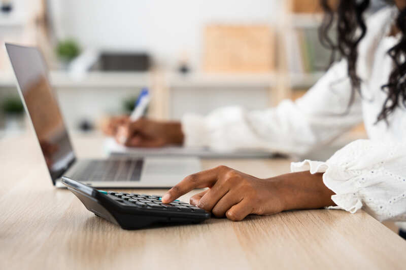 Small business using calculator finance concept