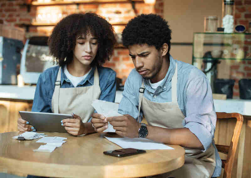 small business owners working on accounting tasks