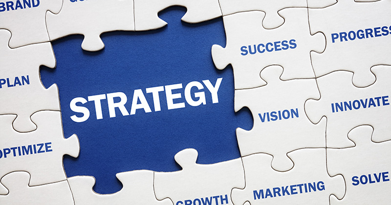 Image-of-a-white-puzzle-with-one-missing-piece-and-in-the-spacce-is-written-Strategy.